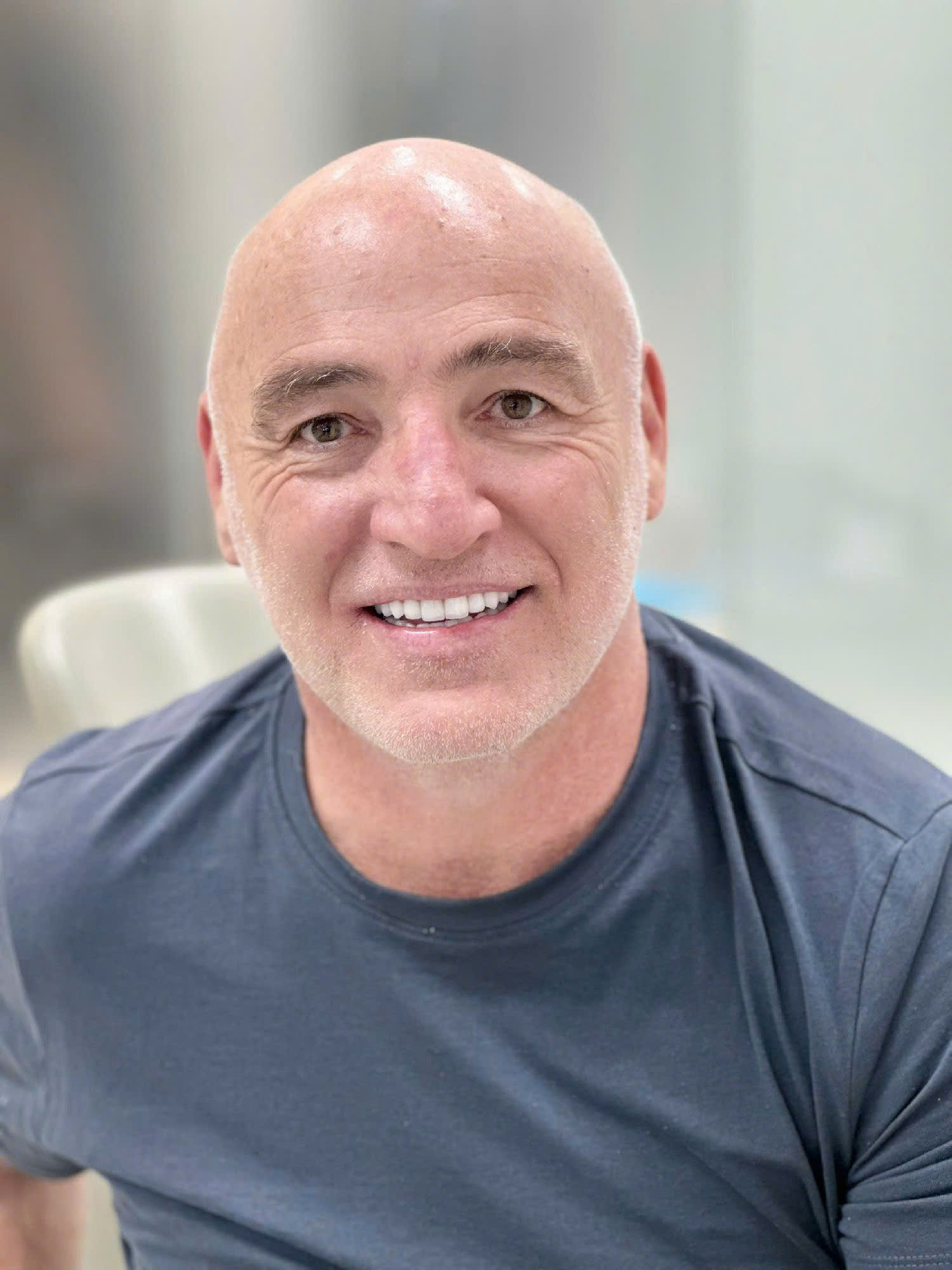 International dental patient smiling after treatment